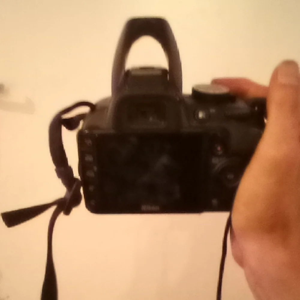 Nikon Black DSLR with Zoom Lens